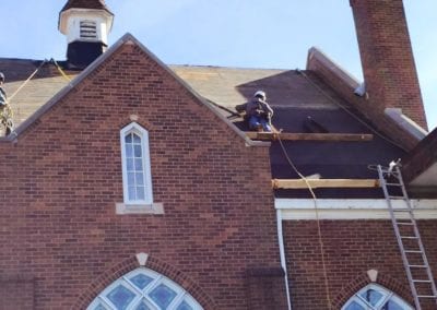roofer-working-on-putting-new-roof-in-church